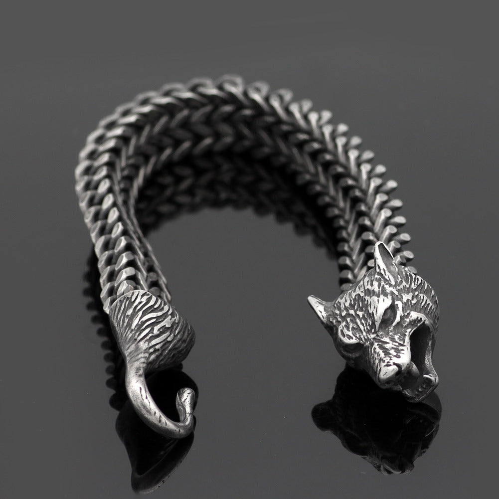 Vintage black wolf head bracelet for men with textured hook clasp and Cuban chain, made from durable stainless steel for bold styling.