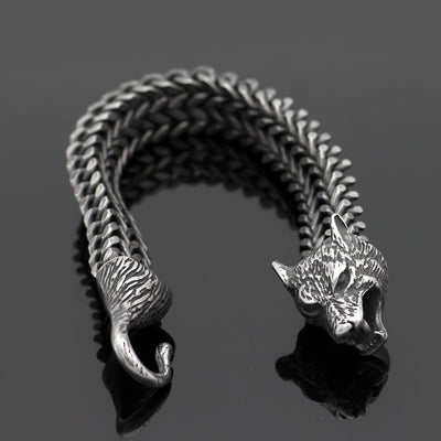 Vintage black wolf head bracelet for men with textured hook clasp and Cuban chain, made from durable stainless steel for bold styling.