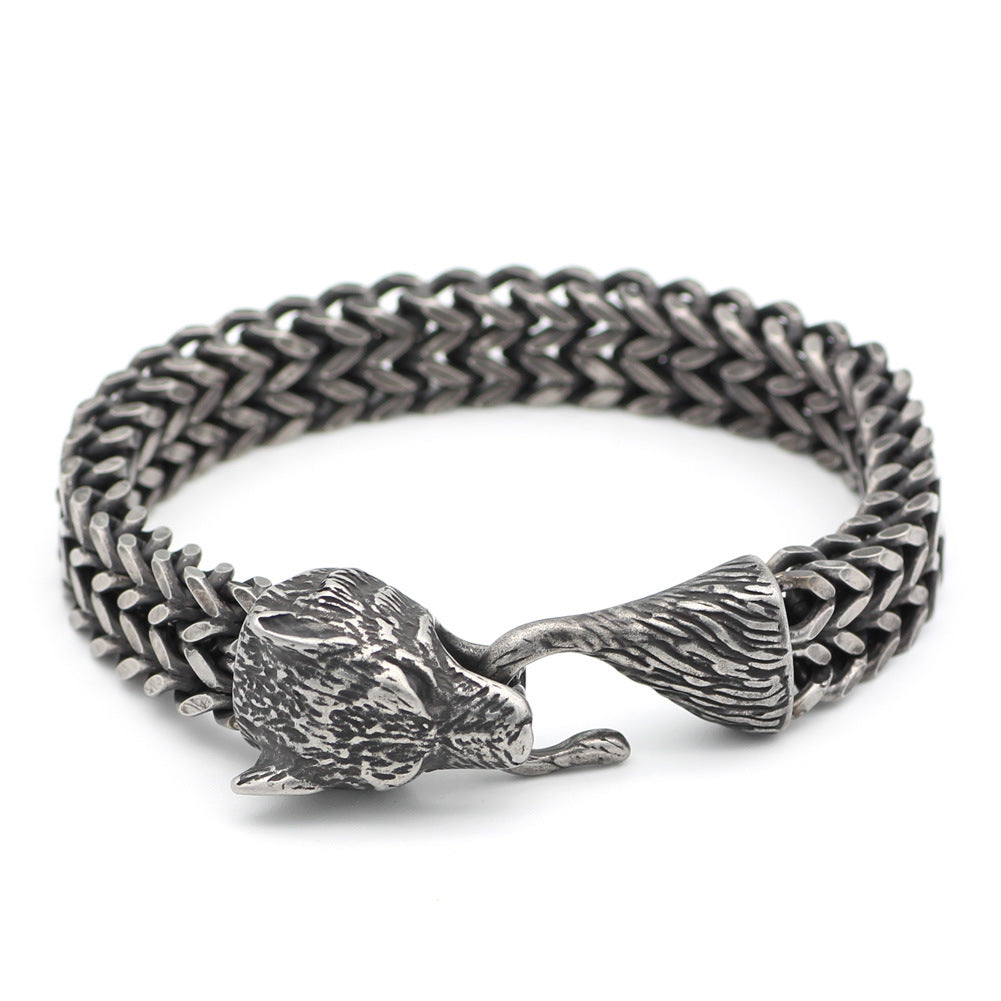 Steel vintage men's bracelet featuring a detailed black wolf head clasp and Cuban chain, ideal for fashion-forward accessories or gifts.