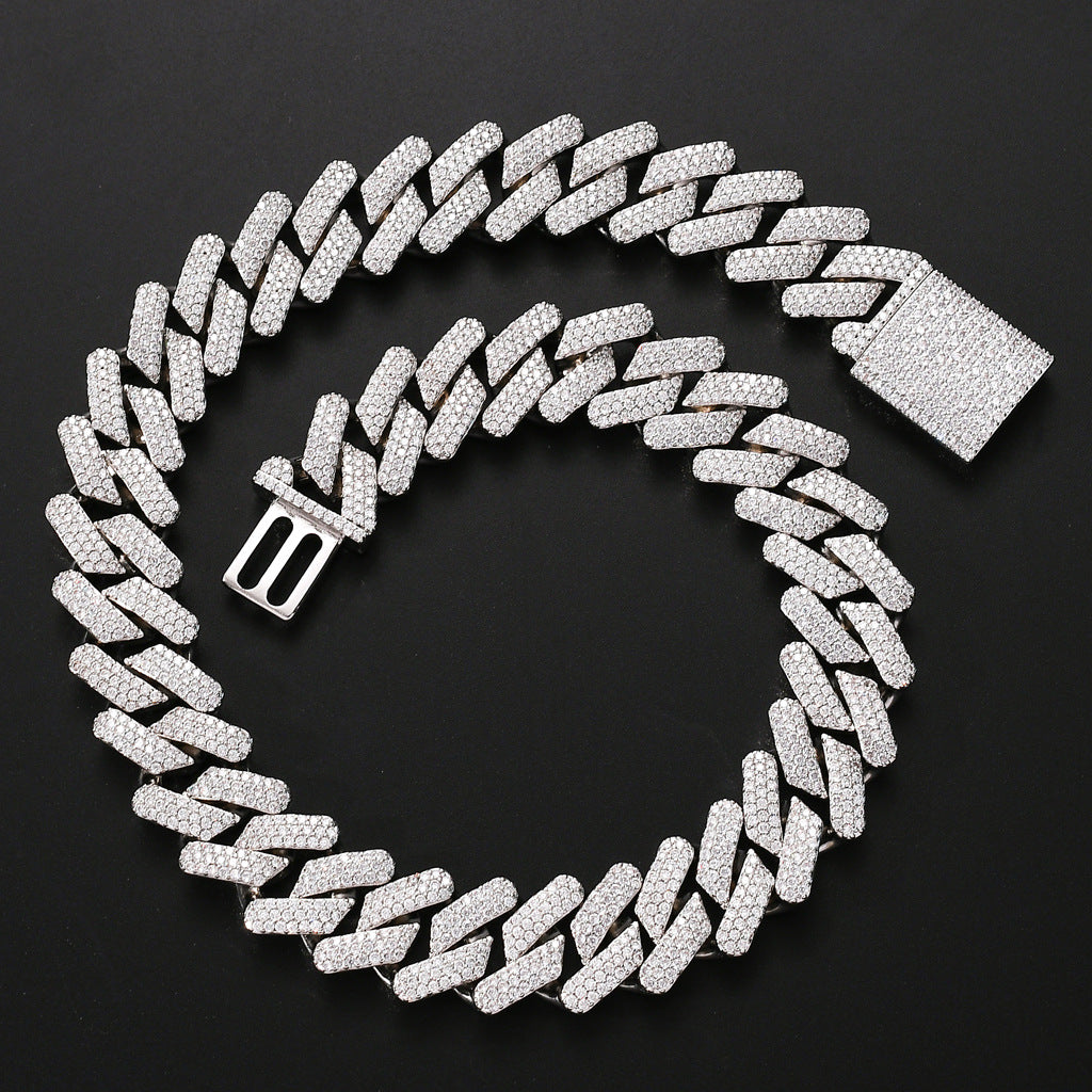 Silver Cuban chain necklace with micro-inlaid zircon and copper base, featuring a rectangular iced-out clasp on black background.