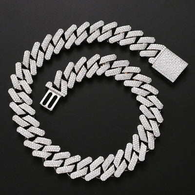 Silver Cuban chain necklace with micro-inlaid zircon and copper base, featuring a rectangular iced-out clasp on black background.