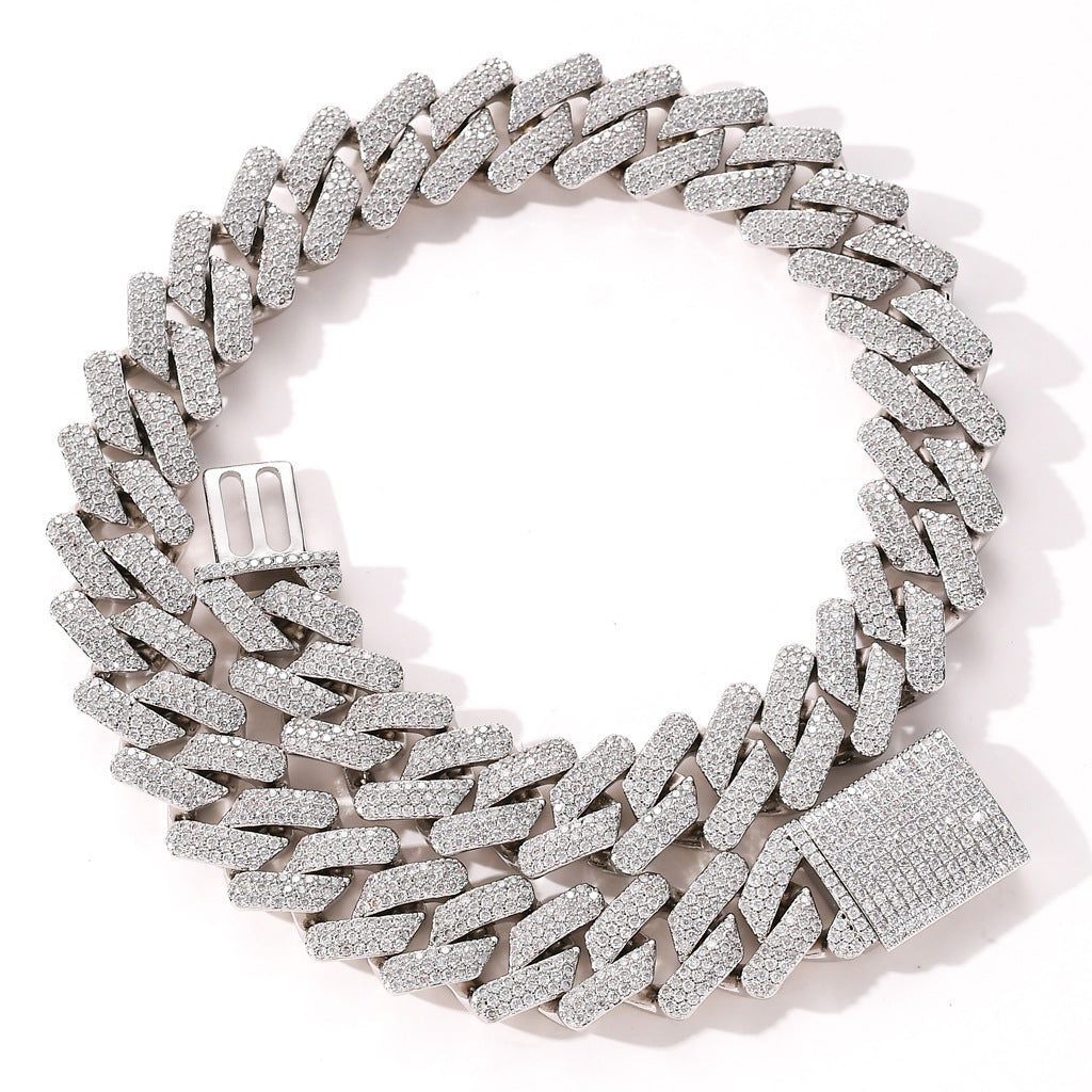 Zircon Cuban chain necklace in silver tone with real gold plating, copper construction and detailed iced-out clasp on white background.