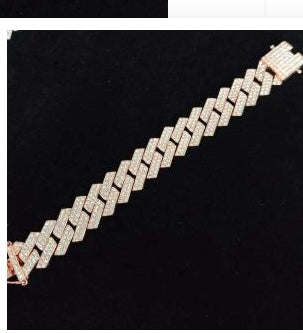 Rose gold zircon hip hop necklace with Cuban chain design, copper base and micro-inlaid zircon, laid flat on black surface.